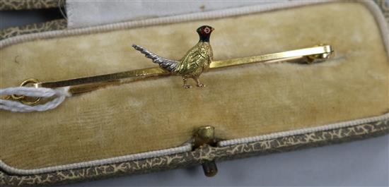 An Edwardian 15ct gold enamel and gem set pheasant bar brooch, in fitted case